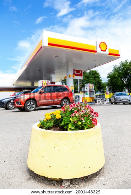 Samara, Russia - July\
2, 2021: Shell gas station in sunny day. Shell V-power fuel\
station. Royal Dutch Shell is an Anglo-Dutch multinational oil and\
gas company