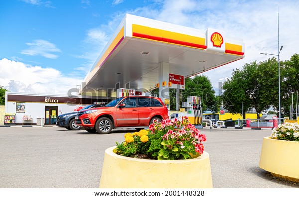 Samara, Russia - July\
2, 2021: Shell gas station in sunny day. Shell V-power fuel\
station. Royal Dutch Shell is an Anglo-Dutch multinational oil and\
gas company