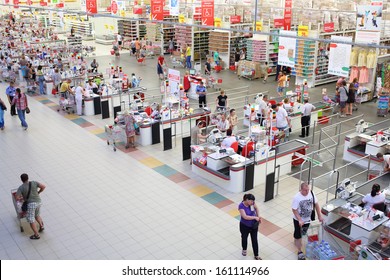 SAMARA, RUSSIA - JULY 7: Shoppers at the checkout lane Auchan hypermarket, July 7, Samara. In Russia there are more than a hundred stores Auchan