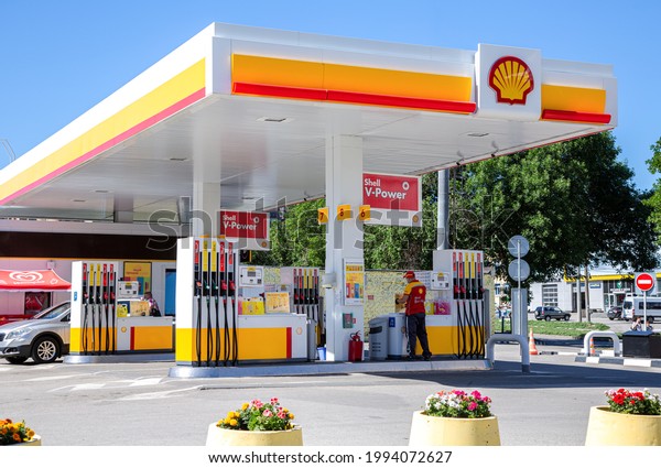 Samara, Russia - June\
18, 2021: Shell gas station in sunny day. Shell V-power petrol\
station. Royal Dutch Shell is an Anglo-Dutch multinational oil and\
gas company