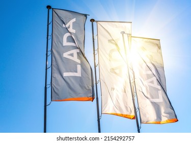 Samara, Russia - May 07, 2022: Dealership Flags Of Car Manufacturer Lada Against The Blue Sky Background