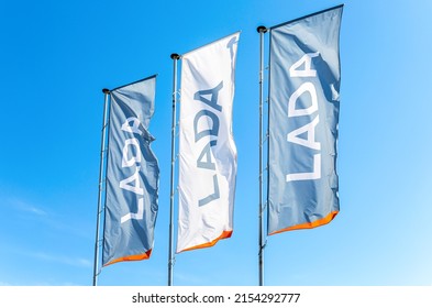 Samara, Russia - May 07, 2022: Dealership Flags Of Car Manufacturer Lada Against The Blue Sky Background