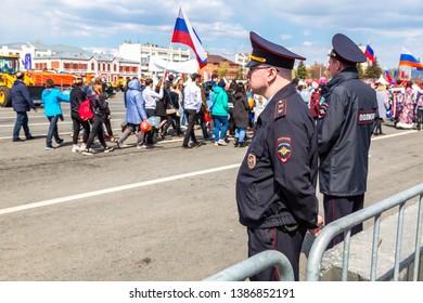 Samara, Russia - May 1, 2019: Unidentified Russian Policemans In Uniform Watching The Rule Of Law During The Demonstration On Labor Day. Text In Russian: Police