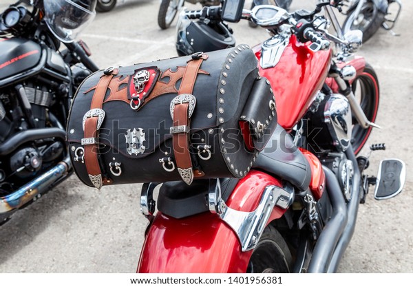 Samara, Russia - May 18, 2019: Leather motorcycle\
bag for carrying luggage. Motorcycle with Leather Saddlebag Trunk\
Bag Luggage