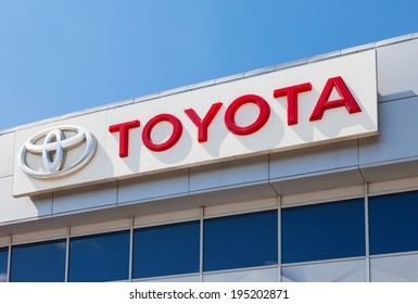 SAMARA, RUSSIA - MAY 24, 2014: The emblem Toyota on the office of official dealer. Toyota Motor Corporation is a Japanese automotive manufacturer headquartered in Toyota, Aichi, Japan
