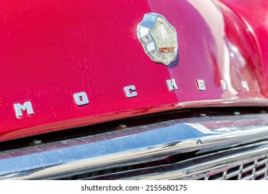 Samara, Russia - May 8, 2022: Close up of a vintage soviet Moskvich logo on the retro car