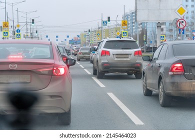 Samara, Russia - November 10, 2019: Cars at the traffic light on the road in city