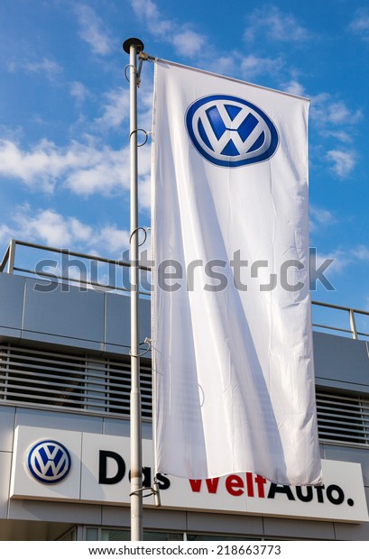 SAMARA, RUSSIA - SEPTEMBER 21,\
2014: The flag of Volkswagen over blue sky. Volkswagen is the\
biggest German automaker and the third largest automaker in the\
world