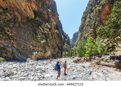 Samaria Gorge, Greece - MAY 26, 2016: Tourists hike in Samaria Gorge in central Crete, Greece. The national park is a UNESCO Biosphere Reserve since 1981