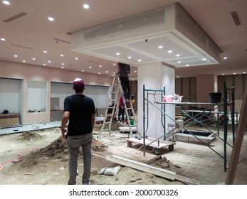 Samarinda, Indonesia - July 01, 2021 : Fitout work in progress, seen the workers doing activities and supervised by the foreman