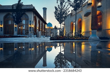 Samarkand Eternal city Boqiy Shahar Registan public square with mosque and minaret modern complex of ancient city with reflection and colorful illumination in Uzbekistan