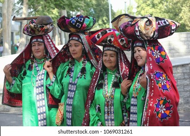 Samarkand.Uzbekistan.October 8, 2013.Women in Samarkand traditional dresses perform in front of the audience at the harvest festival in Samarkand.Uzbekistan