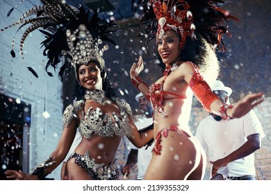 Samba. Shot of two beautiful samba dancers performing in a carnival. - Shutterstock ID 2139355329