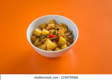 Sambal Goreng Kentang In White Bowl With Orange Background