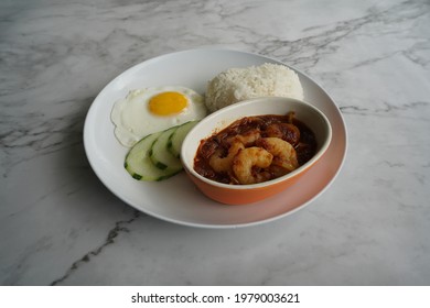 Sambal Prawn Served With White Rice, Fried Egg And Slice Cucumber