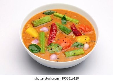 Sambar, Mixed Vegeterian Curry Arranged In A White Bowl On A White Textured Background. 