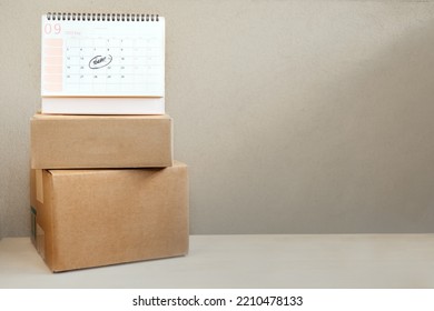 Same Day delivery Ship From Store. Faster Delivery. Many Cardboard boxes and calendar with the date today ready for delivery