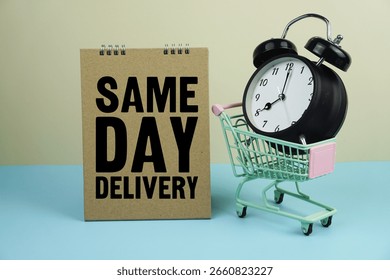 Same Day Delivery wiht mini trolley shopping cart and alarm clock on blue and yellow background