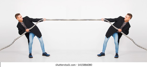 Same male model pulling rope, dilemma concept