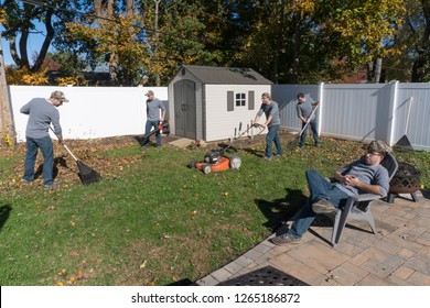 The Same Man Performing Many Landscaping Jobs To Rake Leaves And Clean Back Yard In Autumn Fall Cleanup Appearing To Work As Single Team In Multiple Exposure Photography Effect Humor Funny View