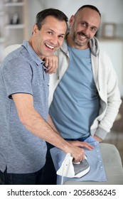 Same Sex Couple Doing The Ironing