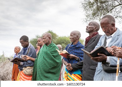 Same, Tanzania, 7th June 2019: Maasai People Reading Bibles In A Group And Worship God