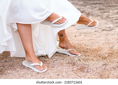 Same-sex Marriage Image Of Two Women On The Beach. Gay Girls Getting Married In A Beautiful Sunset On The Rocks Near The Beach. Real Wedding.