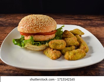 Samon Burger Top With Tomato And Lettuce  Broccoli Tater Tots, 