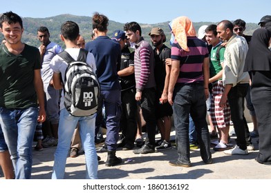 SAMOS, GREECE-August 29, 2015.Asian And African Immigrants On The Island Of Samos. (close To The Hellenic Coast Guard).Participants In The First Wave Of Mass Emigration To Europe Via Turkey And Greece