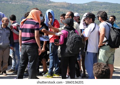 SAMOS, GREECE-August 29, 2015.Asian And African Immigrants On The Island Of Samos. (close To The Hellenic Coast Guard).Participants In The First Wave Of Mass Emigration To Europe Via Turkey And Greece