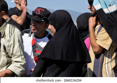 SAMOS, GREECE-August 29, 2015.Asian And African Immigrants On The Island Of Samos. (close To The Hellenic Coast Guard).Participants In The First Wave Of Mass Emigration To Europe Via Turkey And Greece