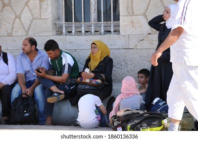 SAMOS, GREECE-August 29, 2015.Asian And African Immigrants On The Island Of Samos. (close To The Hellenic Coast Guard).Participants In The First Wave Of Mass Emigration To Europe Via Turkey And Greece