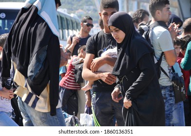 SAMOS, GREECE-August 29, 2015.Asian And African Immigrants On The Island Of Samos. (close To The Hellenic Coast Guard).Participants In The First Wave Of Mass Emigration To Europe Via Turkey And Greece