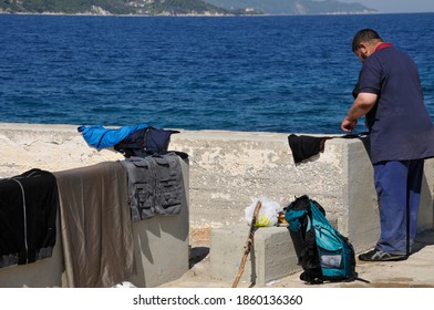 SAMOS, GREECE-August 29, 2015.Asian And African Immigrants On The Island Of Samos. (close To The Hellenic Coast Guard).Participants In The First Wave Of Mass Emigration To Europe Via Turkey And Greece