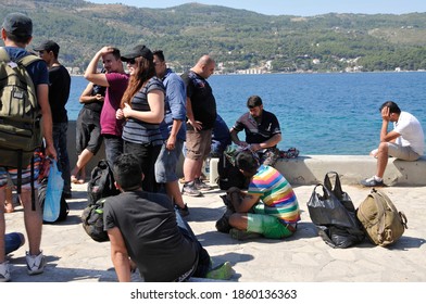 SAMOS, GREECE-August 29, 2015.Asian And African Immigrants On The Island Of Samos. (close To The Hellenic Coast Guard).Participants In The First Wave Of Mass Emigration To Europe Via Turkey And Greece