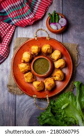 Samosa On A Plate With Sauce And Tomatoes Horizontal View From Above Rustic Style