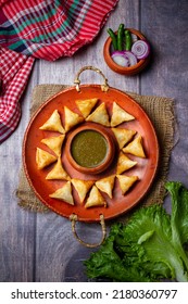 Samosa On A Plate With Sauce And Tomatoes Horizontal View From Above Rustic Style