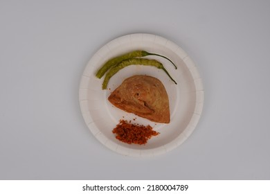 Samosa In Plate With Green Chutney And Imli [tamarind] Chutney
