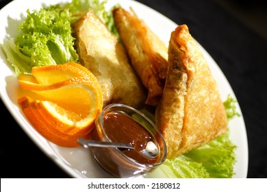 samosa with plum sauce and orange salad