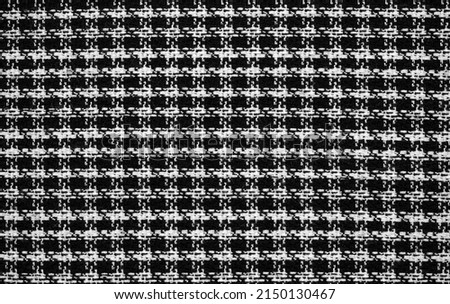A sample of black and white fabric with a 