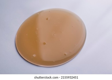 Sample Of Brown Shower Gel On White Background