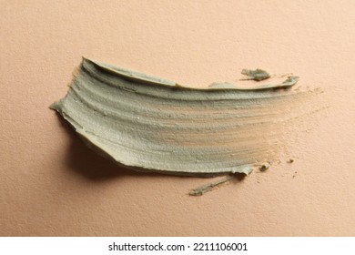 Sample Of Face Cream On Pale Orange Background, Top View