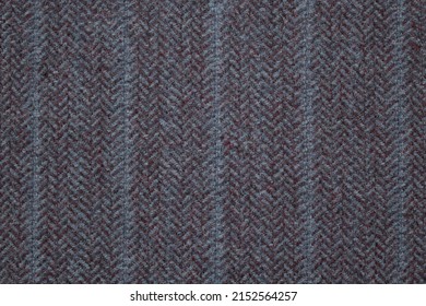 A Sample Of Gray Tweed Suit Fabric. Textile Background With A Classic  Herringbone Pattern. An Image Of Elegant Suit And Coat Fabric.