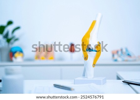 A Sample or model of knee or joint with copy space to explain about osteoarthritis, orthopedics or knee or joint problem. Concept of health care of senior, doctor is explain of symptoms and treatment.