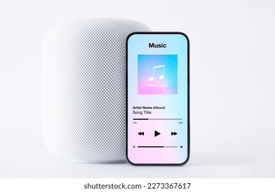Sample music player app mobile phone in front wireless speaker white background