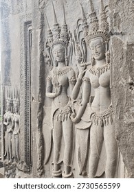 A sample of only a few of the Devatas in bas relief on the walls of Angkor Wat. Each of the thousand Devatas of Angkor Wat are unique and that makes viewing them a worthwhile experience. Angkor Wat, Angkor Archeological Park, Siem Reap Province, Cambodia.