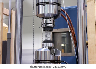 A Sample Of Permeable Concrete Undergoes A Compressive Strength Test