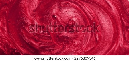 Sample of red glitter gel with small particles, texture of highlighter cosmetics, lipstick, blush