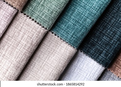 Sample of velvet and velours textile various colors, background. Catalog and swatch tone of Interior fabric for furniture, closeup. Collection of multicolored cloth.