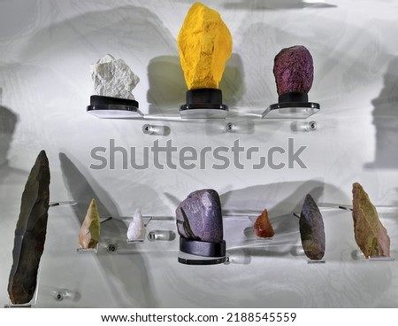 Sampler of lithic tools from archaeological sites in the Northern Territory in public display: white ochre-yellow ochre-red ochre-bifacial point-unifacial point-edge ground hatchet. Darwin-Australia.
